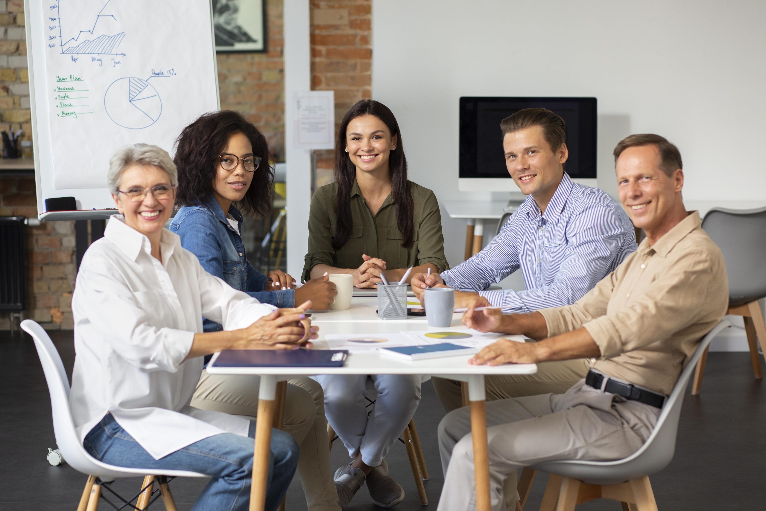 people smiling while conference room scaled