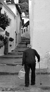 rear view man walking road scaled